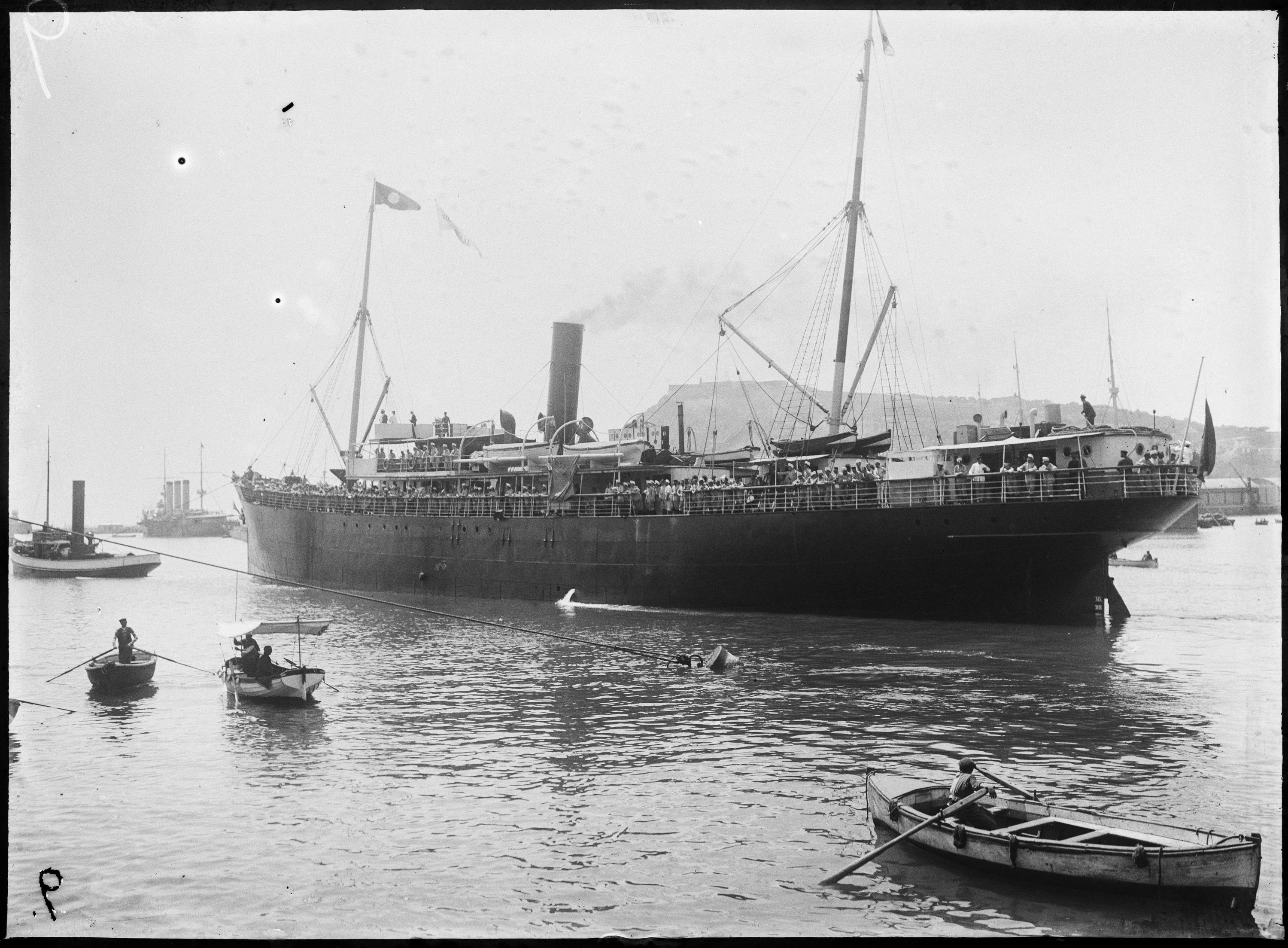 Steamship Villarreal of the Compañía Trasmediterránea S. A. leaving the Port of Barcelona and transporting troops to Africa